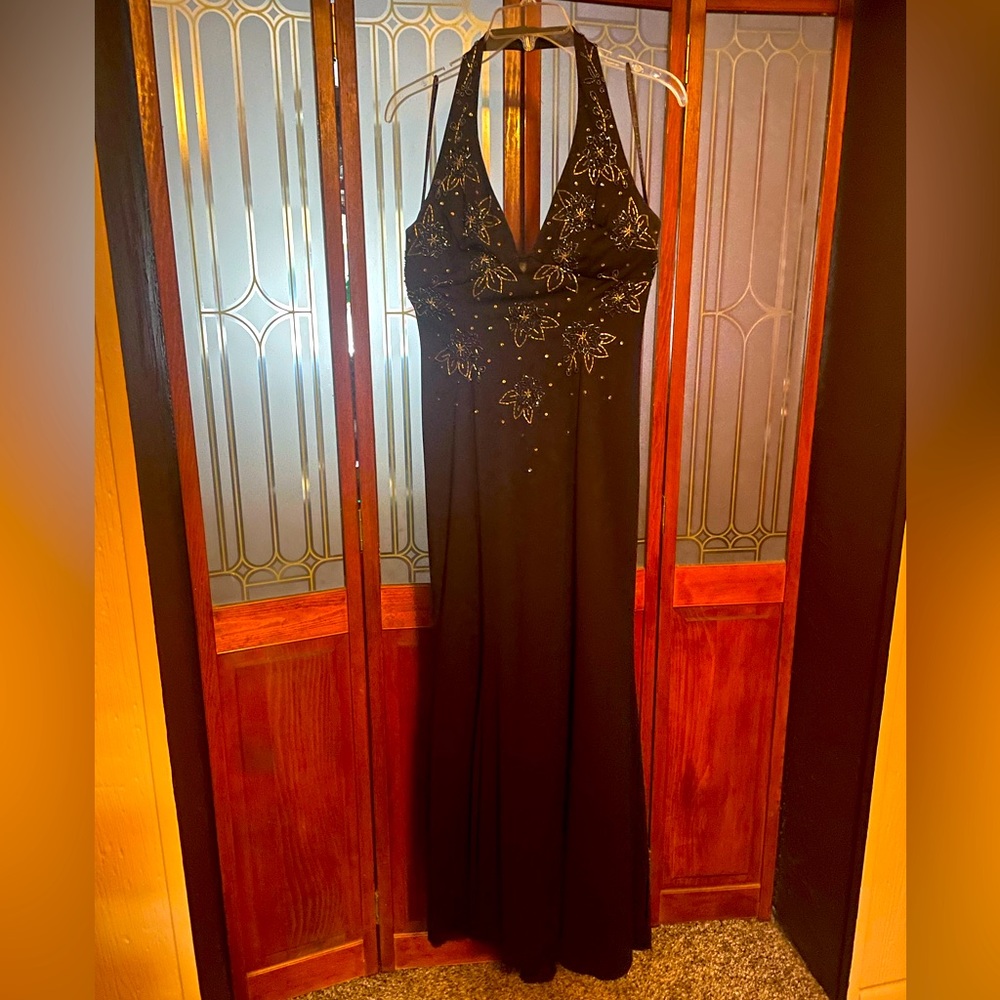 Long black formal dress with beads and gems forming flowers, decor